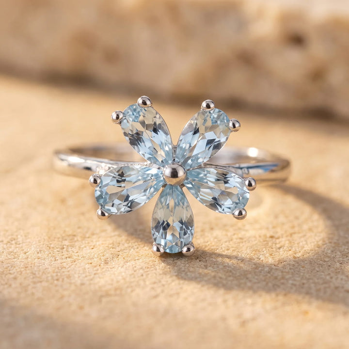 "Flower of Light" Ring in Blue Topaz
