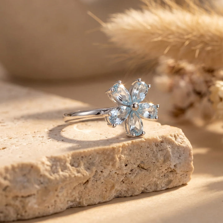 "Flower of Light" Ring in Blue Topaz