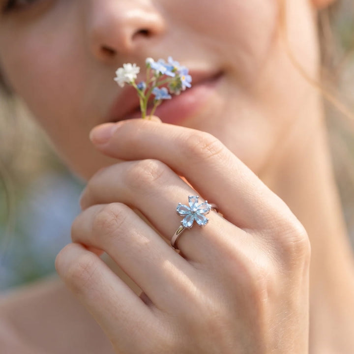 "Flower of Light" Ring in Blue Topaz