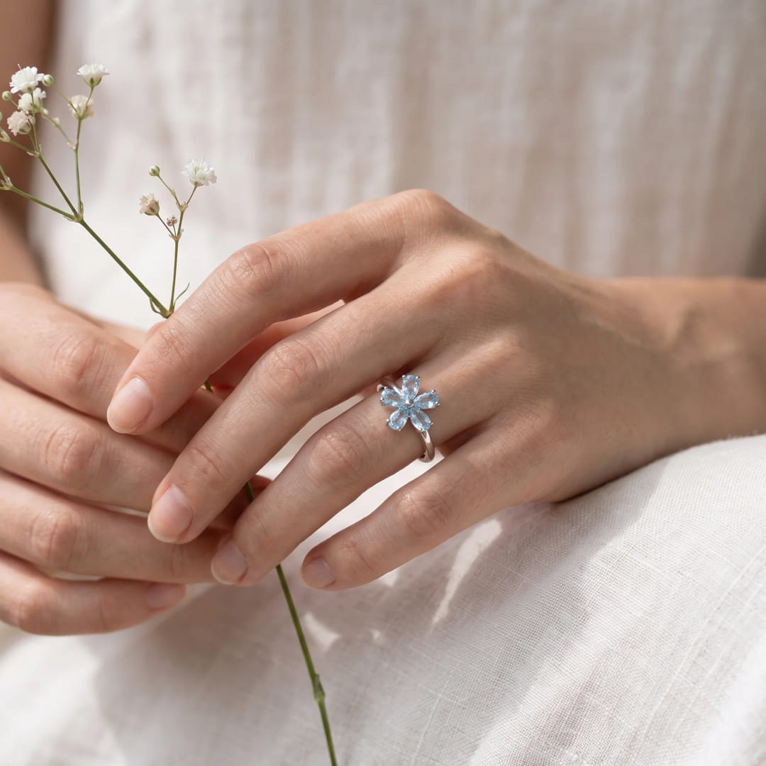 "Flower of Light" Ring in Blue Topaz
